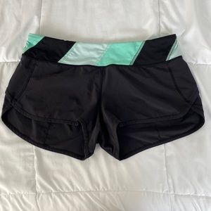 Lululemon speed short size 8 EUC. Black with seafoam green waist detail